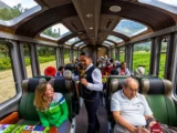 Passengers enjoying the panoramic Vistadome train ride to Machu Picchu