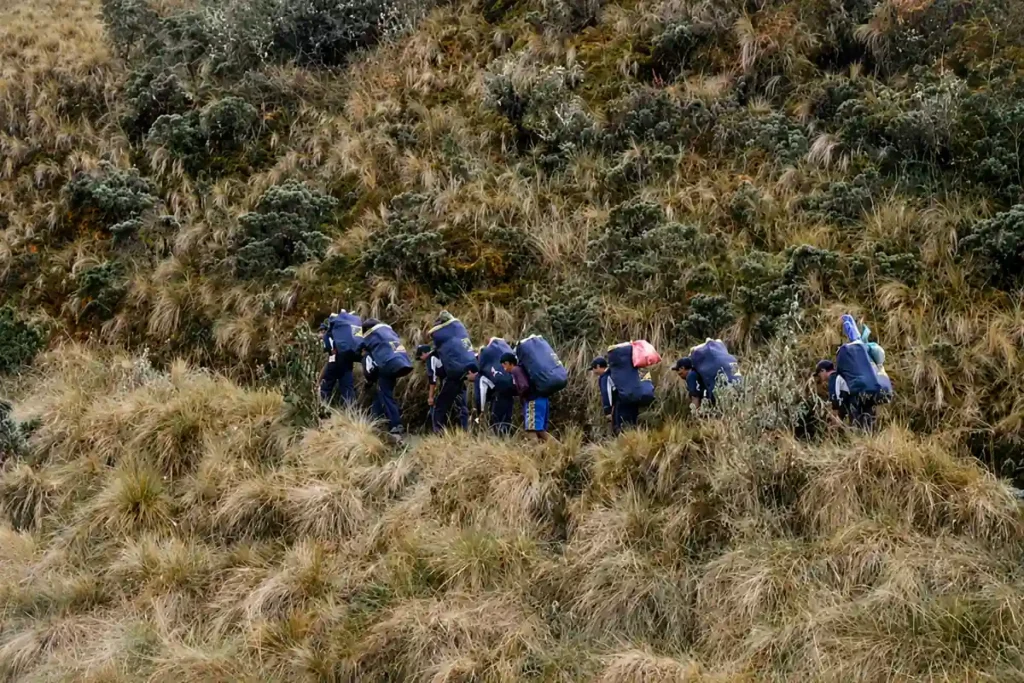 Porters carrying gear on the Inca Trail