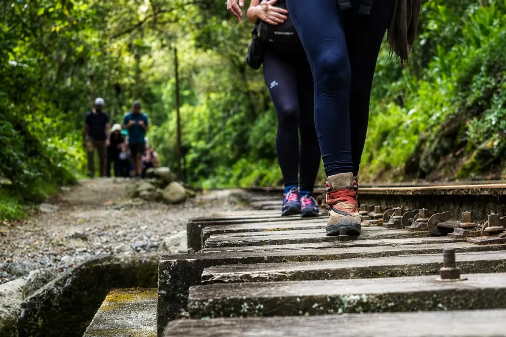 Travelers walking along the train tracks between Hidroelectrica and Aguas Calientes