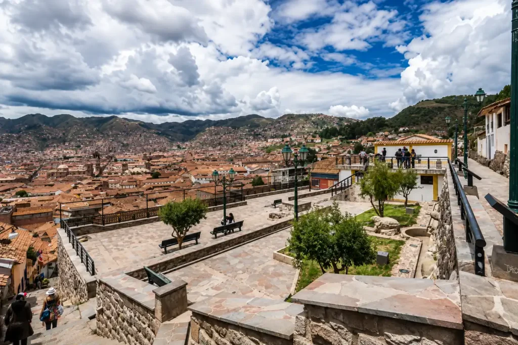 Viewpoint overlooking Cusco city from a mirador, showing the city's high altitude