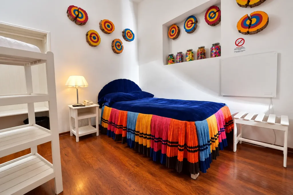 Guest room with Andean textile decor at Tika Wasi Casa Boutique, a hotel to stay in San Blas Cusco