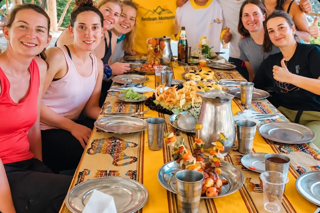 Group of trekkers at the lunch table with the Andean Moments kitchen crew on the Choquequirao Trek