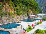 Cocalmayo hot springs pools in a green valley near Santa Teresa on the Inca Jungle Trail
