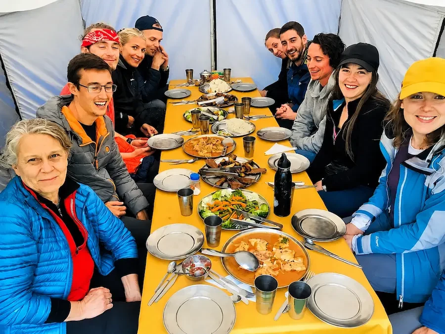 Trekkers sharing a buffet dinner inside the dining tent on the Inca Trail to Machu Picchu