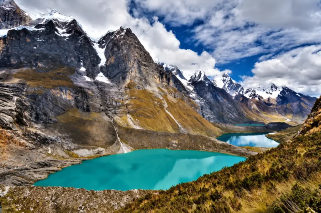 Turquoise lakes below the Huayhuash peaks under a clear dry season sky