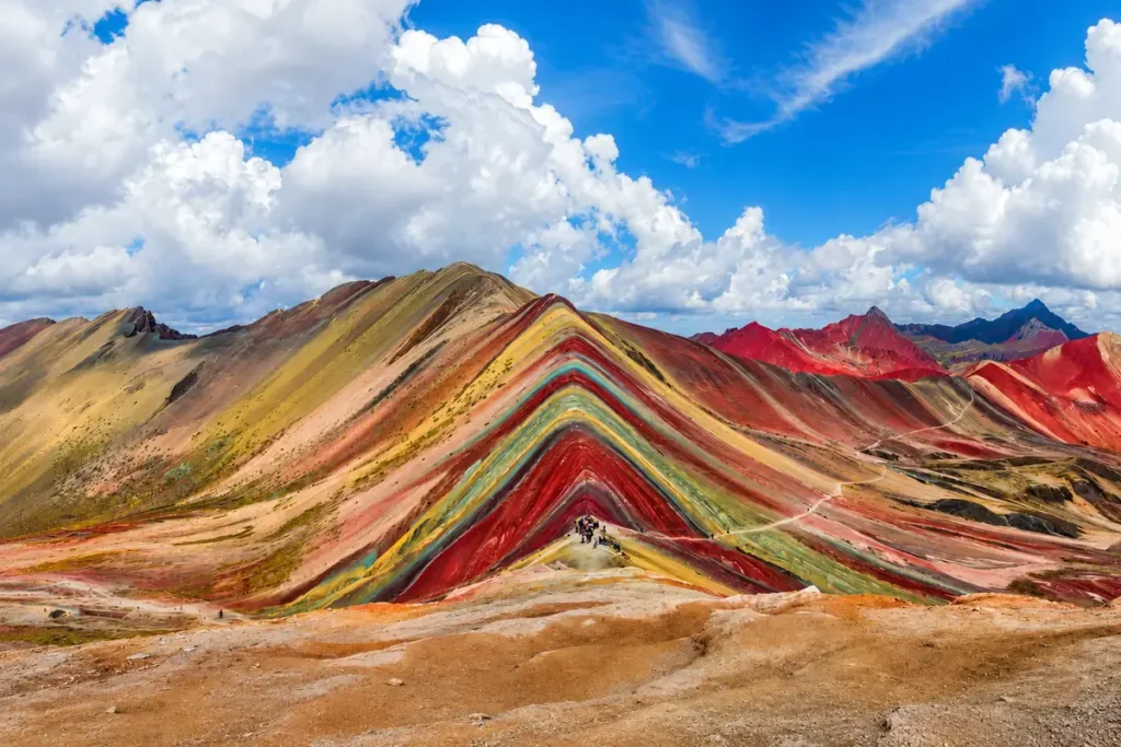 Rainbow Mountain Vinicunca with its colored stripes under a blue sky