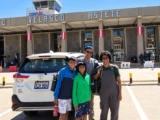 Family with their private car and driver in Cusco