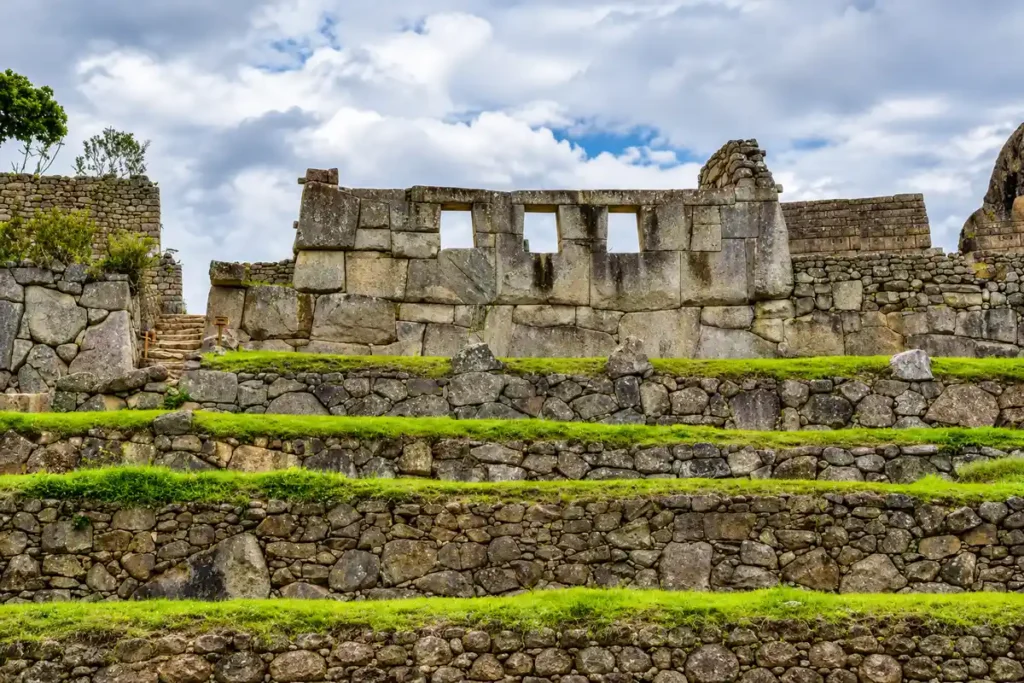 Temple of the Three Windows at Machu Picchu above Inca terraces, where Agustín Lizárraga wrote his name in 1902